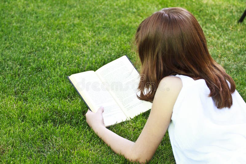 Young beautiful girl reading