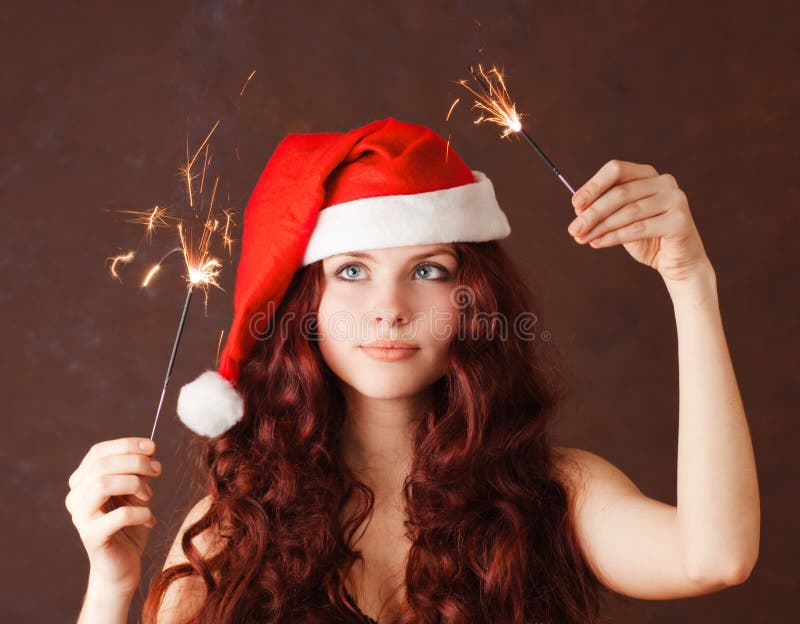 Young beautiful girl in Santa Claus hat