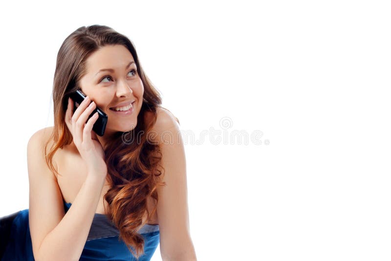 Young beautiful girl talking on a cell phone