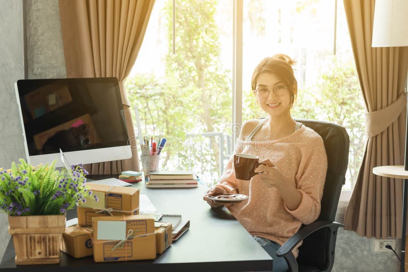 Young beautiful girl working at home in morning, young entrepreneur conceptual. Young beautiful girl working at home in morning, young entrepreneur conceptual