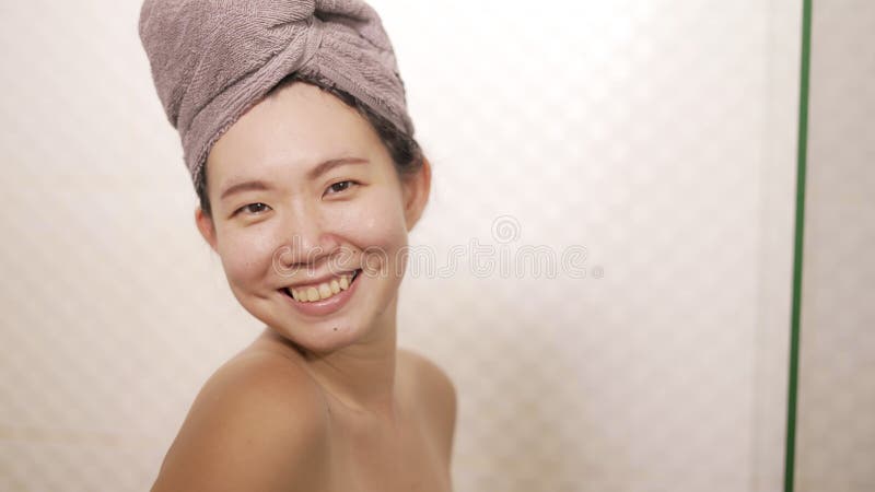 Young Beautiful And Happy Asian Chinese Woman With Head Wrapped In Towel Smiling Fresh And 