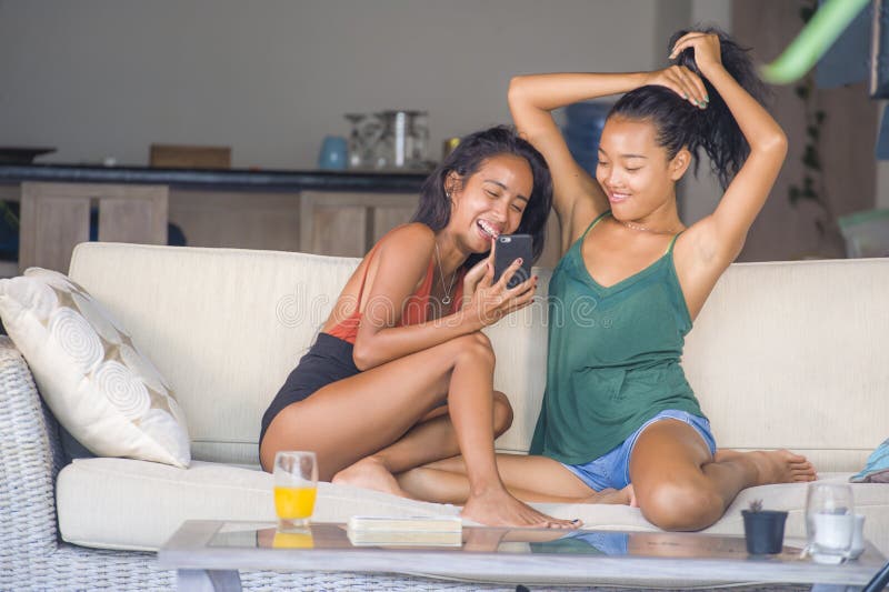 https://thumbs.dreamstime.com/b/young-beautiful-happy-asian-girlfriends-couple-sisters-enjoying-internet-social-media-having-fun-together-mobile-phone-121688303.jpg