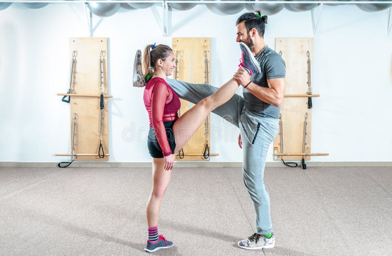 Young Healthy Yoga Fitness Acrobatic Couple Having Fun in the Gym Performing  and Practicing Funny Acrobat Poses Real People Traini Stock Photo - Image  of flying, female: 141790632