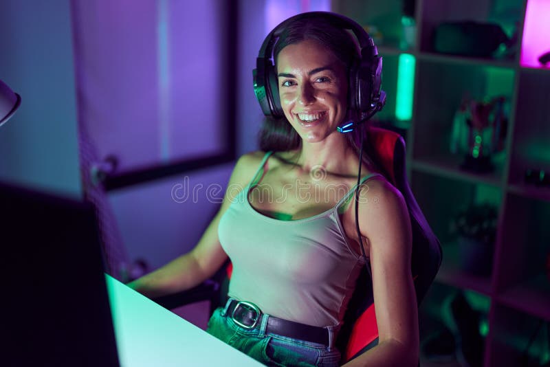 Young Beautiful Hispanic Woman Streamer Playing Video Game Using