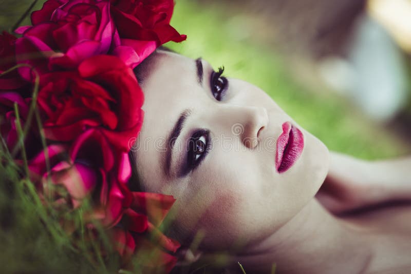 Young beautiful japanese woman with pink and red flowers