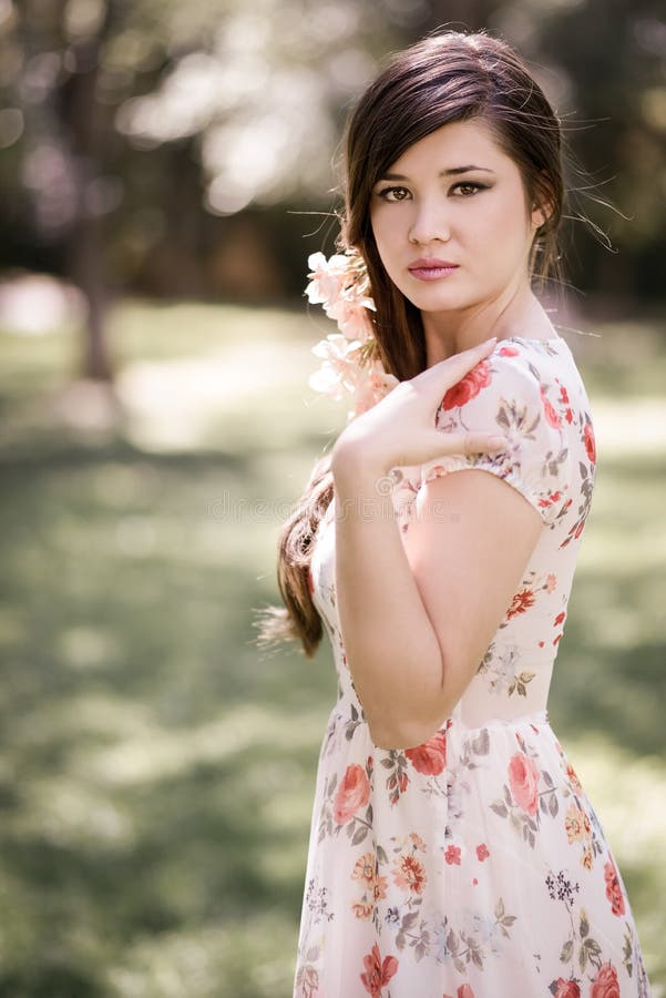 Young beautiful japanese woman with pink and red flowers