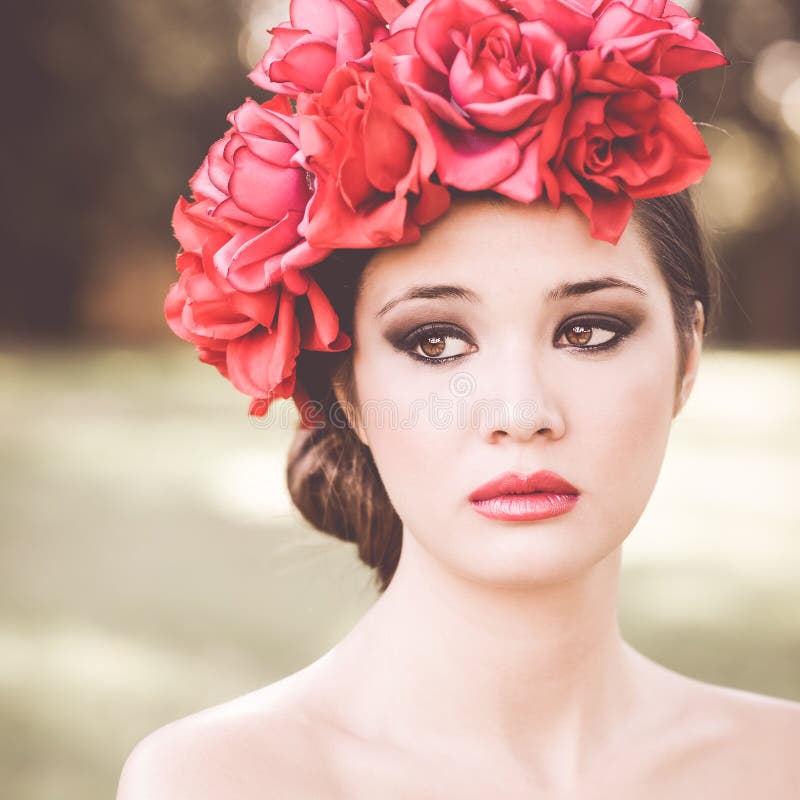 Young beautiful japanese woman with pink and red flowers