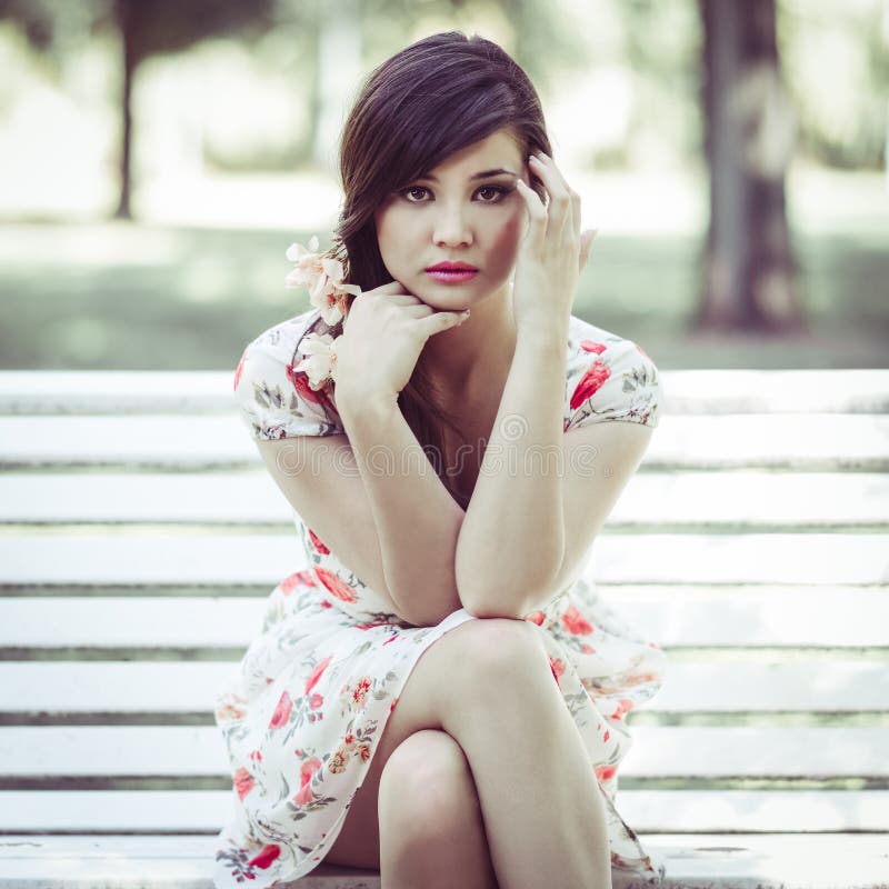 Young Beautiful Japanese Woman With Pink And Red Flowers Stock Image