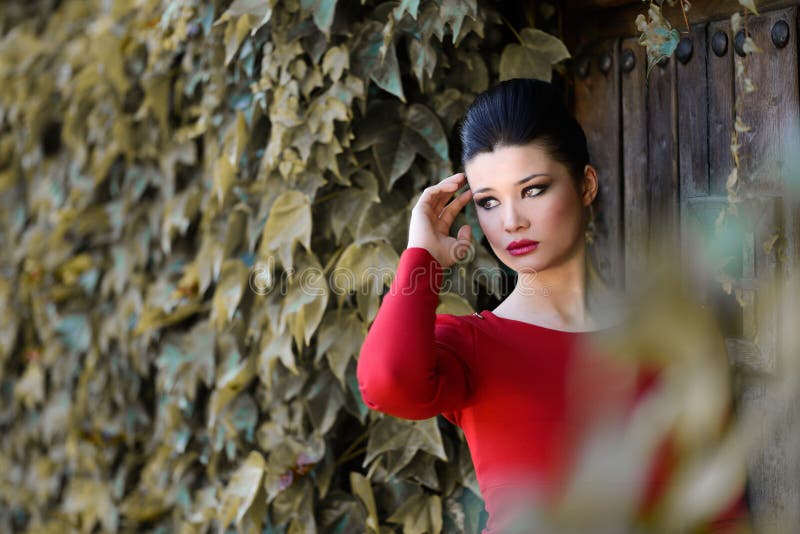 Young beautiful japanese woman with red dress