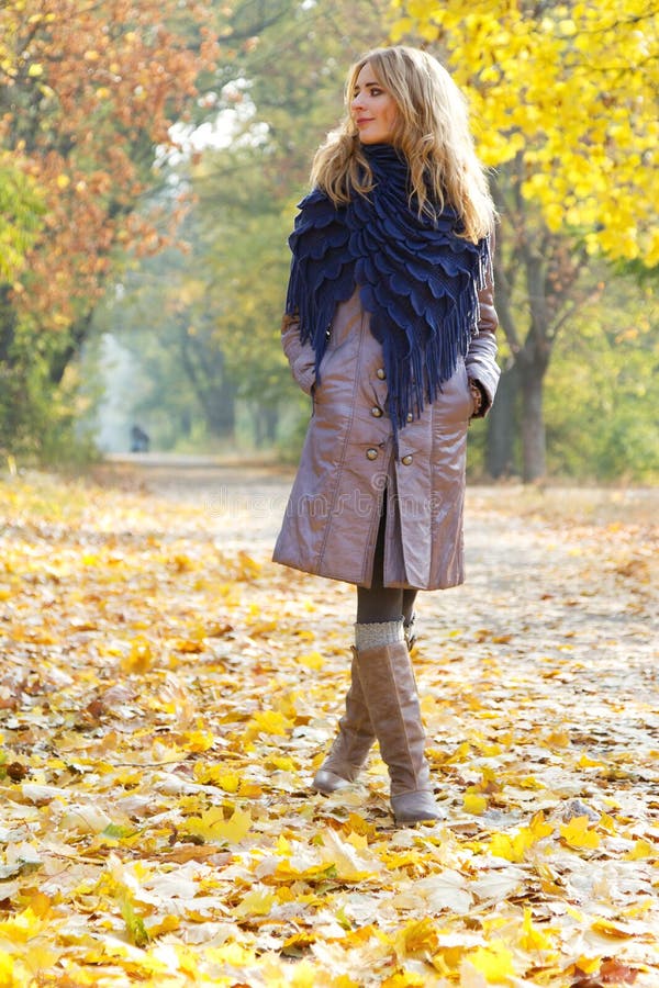 Young beautiful lady in an autumn park