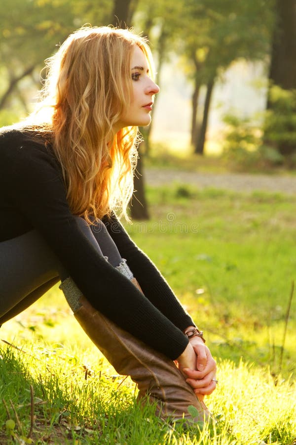 Young beautiful lady in an autumn park