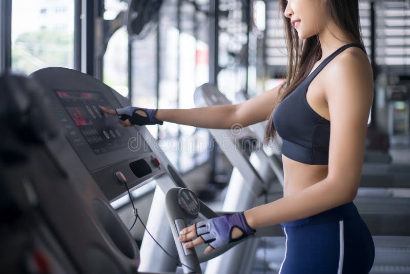 Beautiful Lady Fitness Plank on the Floor with Grey Background Stock