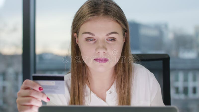 Young Beautiful Lady Looking at the Laptop