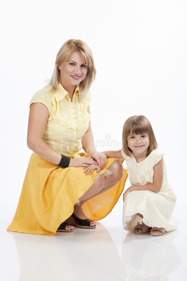 Young beautiful mother and daughter smiling