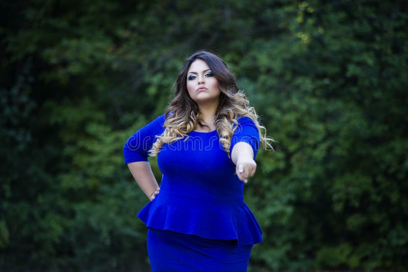 Young Beautiful Stylish Plus Size Fashion Model in Blue Dress Outdoors ...