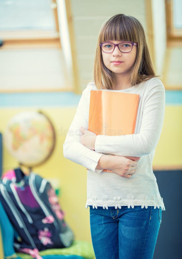 Young Of Beautiful Pre-Teen Girl With Booklet A Child Doing Homework Stock Image -3604