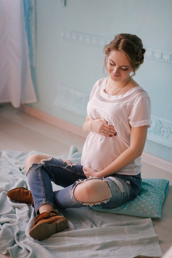 Young beautiful pregnant woman in vintage interior stock image Young beautiful pregnant woman in vintage interior stock image