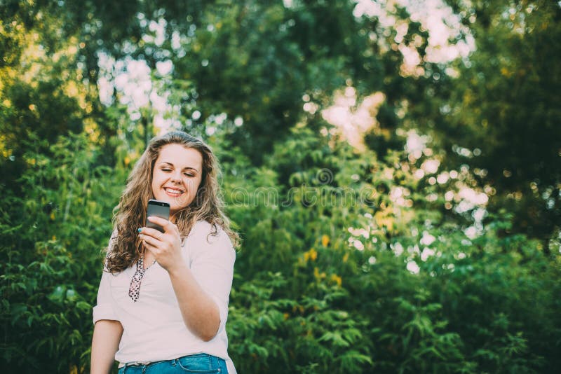 Young Beautiful Pretty Plus Size Caucasian Girl Woman Dressed In White Blouse And Blue Jeans Enjoying Life, Smiling And stock images Young Beautiful Pretty Plus Size Caucasian Girl Woman Dressed In White Blouse And Blue Jeans Enjoying Life, Smiling And stock images