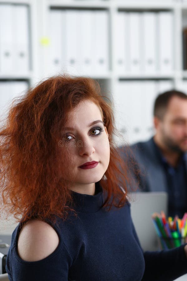 Young Beautiful Red Haired Woman Sit at Table in Office in Cabinet of ...