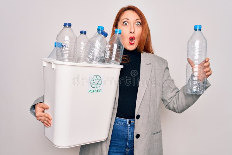 Young Beautiful Redhead Woman Recycling Holding Trash Can with Plastic ...