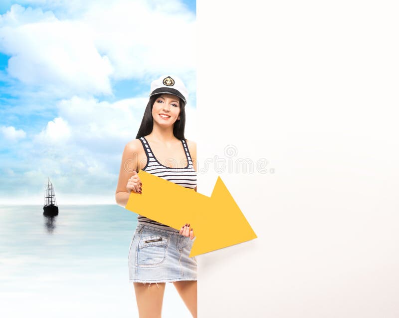 Young, beautiful and sailor girl on a sea background.