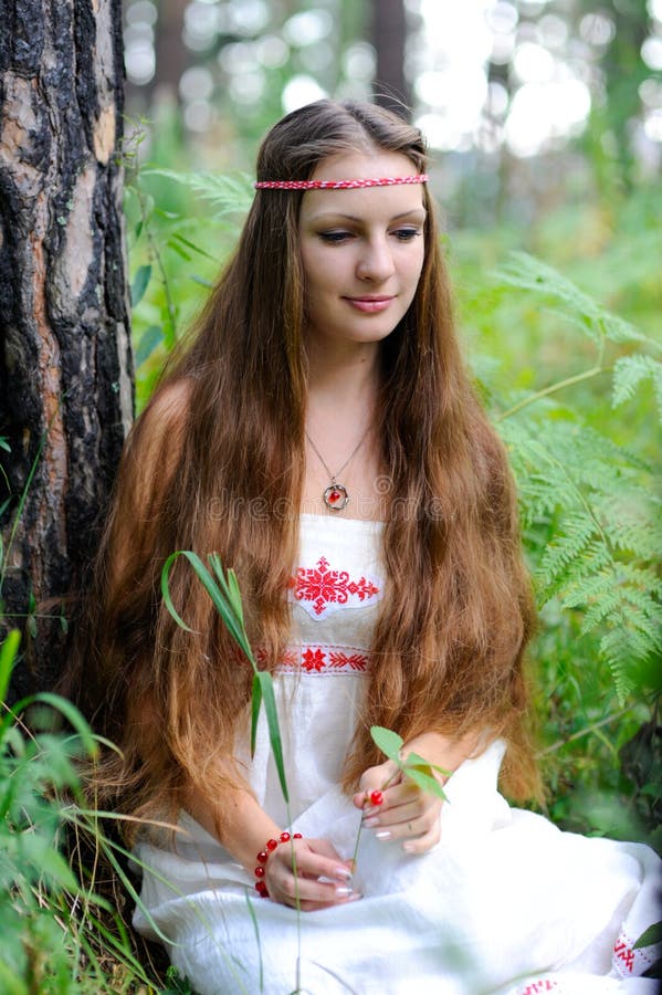 https://thumbs.dreamstime.com/b/young-beautiful-slavic-girl-long-hair-slavic-ethnic-attire-sits-summer-forest-holds-red-berry-her-hands-106909019.jpg