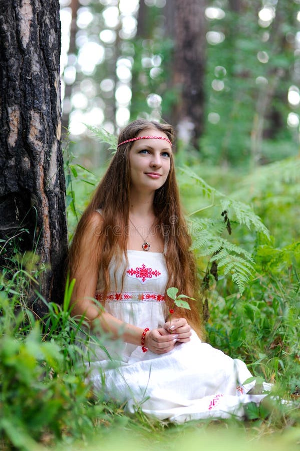 https://thumbs.dreamstime.com/b/young-beautiful-slavic-girl-long-hair-slavic-ethnic-attire-sits-summer-forest-holds-red-berry-her-hands-106909042.jpg