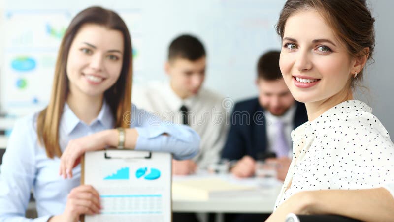 Young beautiful smiling clerk in office looking in camera stock photography Young beautiful smiling clerk in office looking in camera stock photography