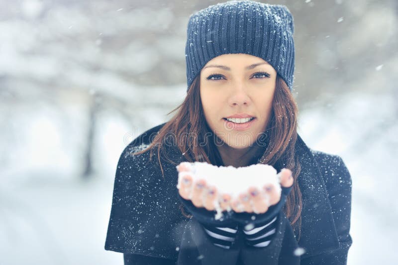 Young Beautiful Smiling Girl Holding Snow in Hands Stock Photo - Image ...