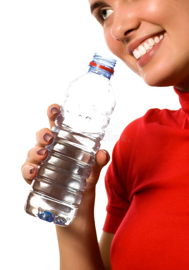 Young beautiful smiling girl with mineral water