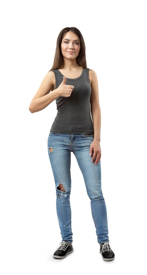 Fit Beautiful Woman in Gray Top and Blue Jeans Standing in Half-turn ...