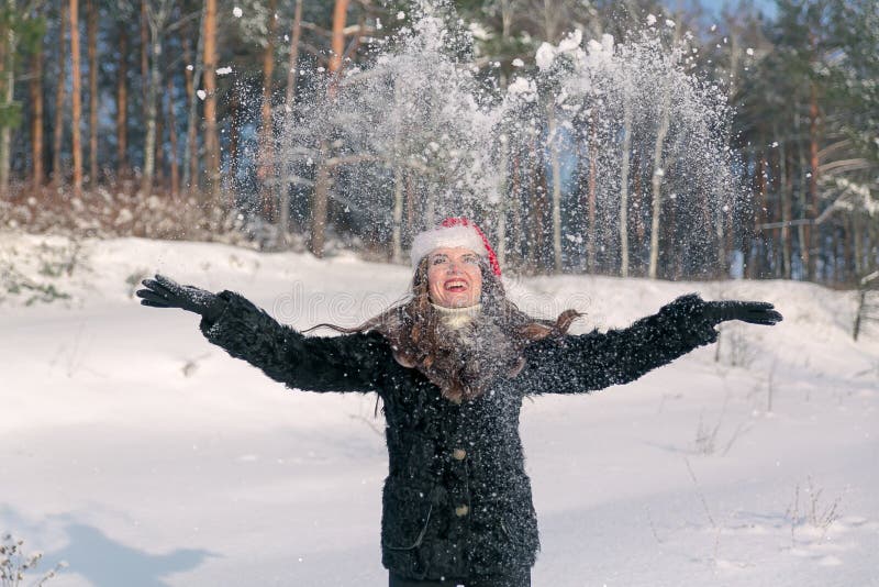 Young Beautiful Smiling Woman Throwing Snow in the Air in Winter ...