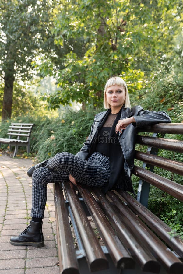 Young beautiful strong independent rebel blonde woman Punk music and style fan posing. Confident Punk-Rock youth culture street