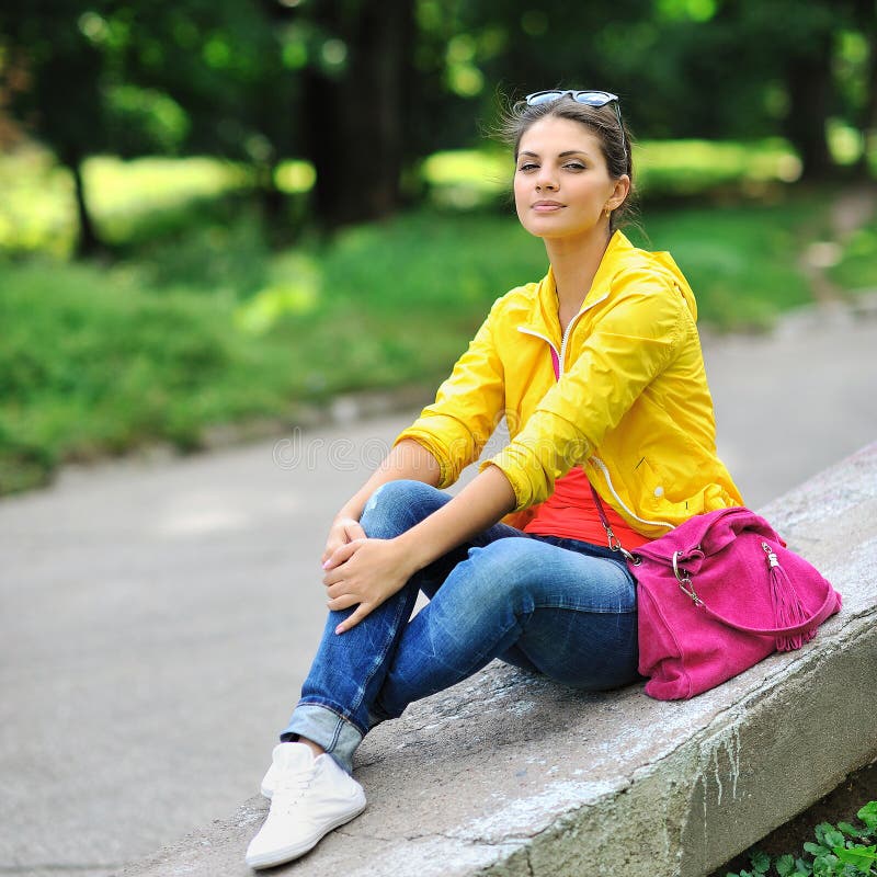 Young Beautiful Stylish Girl with Bag in a Summer Park Stock Image ...
