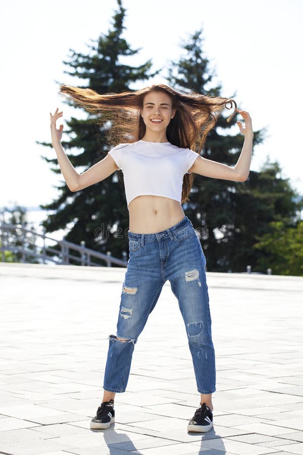 Young Beautiful Teenager Girl Posing Against Summer Park, Bright Sunny ...