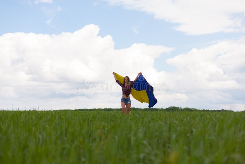 Beautiful Ukrainian Girl in a Plaid Shirt and Short Denim Shorts Stock ...