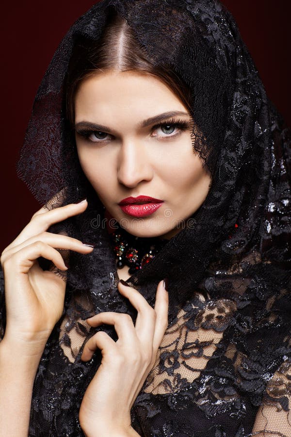 Young beautiful woman in black dress on marsala color background royalty free stock photography Young beautiful woman in black dress on marsala color background royalty free stock photography