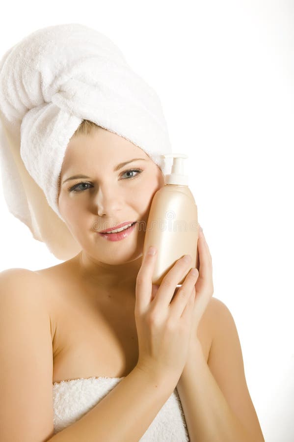 Young beautiful woman with body lotion