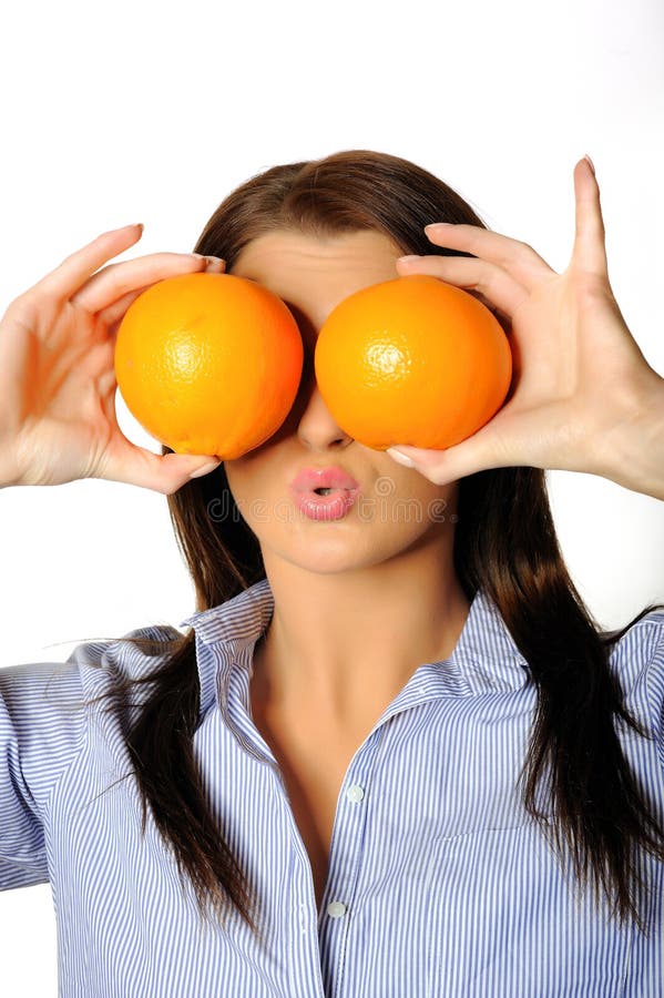 Young beautiful woman with citrus orange fruit