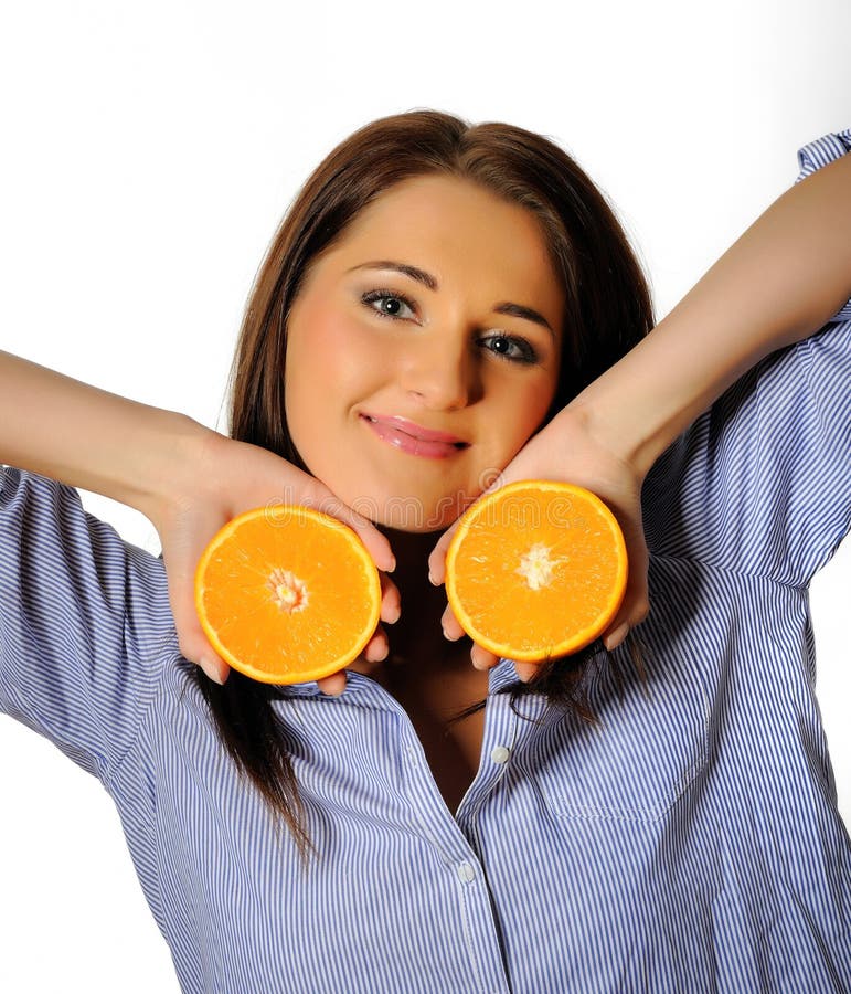 Young beautiful woman with citrus orange fruit