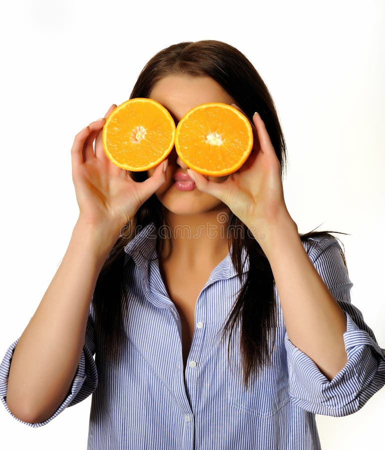 Young beautiful woman with citrus orange fruit