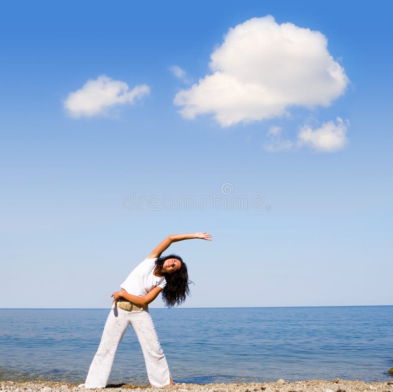 Young beautiful woman doing fitness exercises