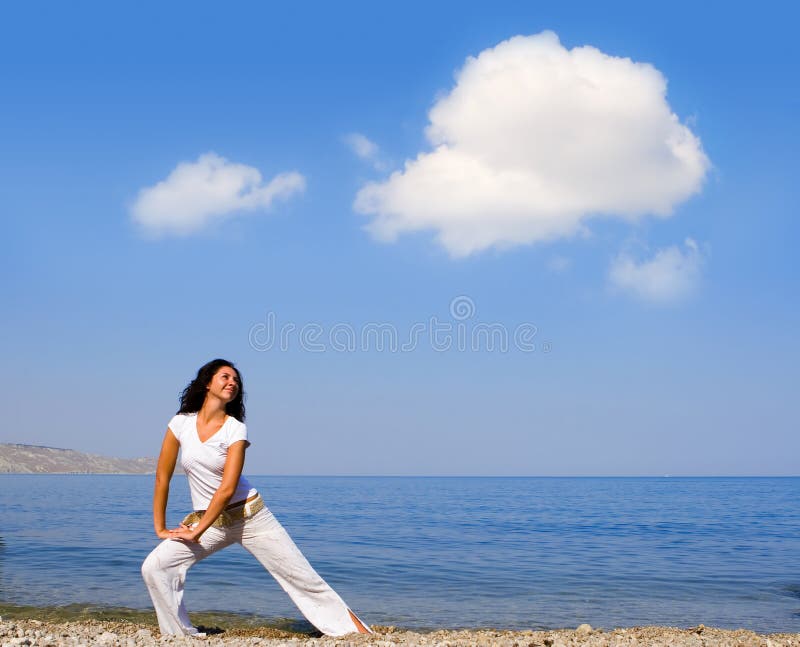 Young beautiful woman doing fitness exercises