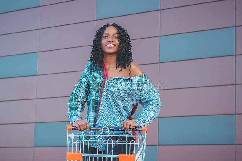 Young Beautiful Woman Dressed in Casual Clothes with a Shopping Cart ...