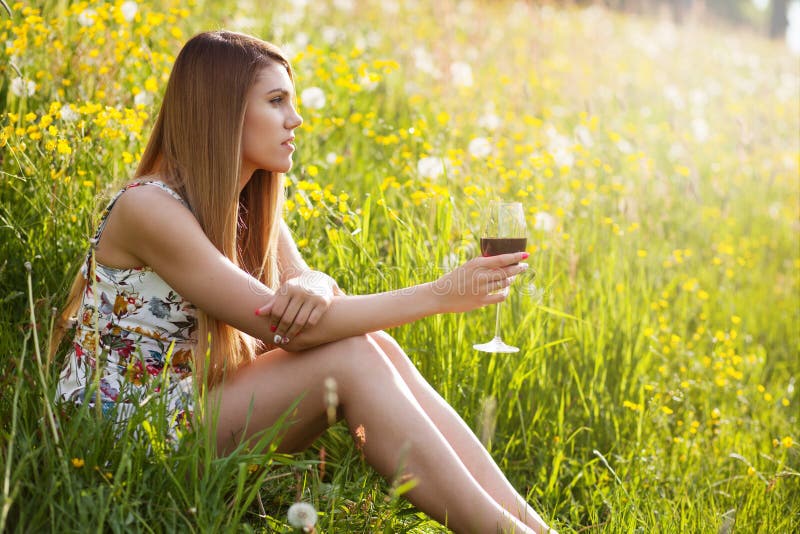 Young beautiful woman drinking wine outdoors royalty free stock images Young beautiful woman drinking wine outdoors royalty free stock images