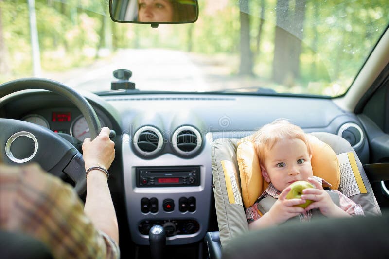 Young Beautiful Woman Driving a Car. on a Front Seat Mounted Child Safety Seat with a Pretty 1 Year Old Toddler Boy. Child Stock Photo Image of auto parenting 147197874