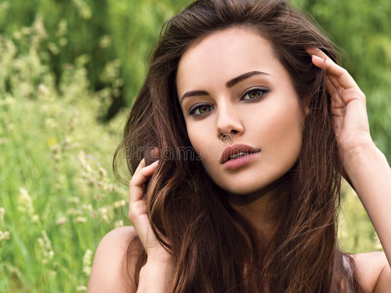 young beautiful woman with long hairs. outdoors. stock image young beautiful woman with long hairs. outdoors. stock image