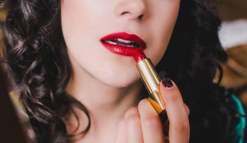 Young beautiful woman with perfect skin using red lipstick royalty free stock image Young beautiful woman with perfect skin using red lipstick royalty free stock image