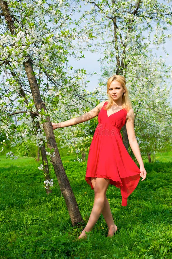 Young beautiful woman in a red dress