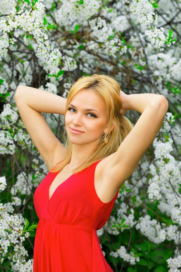 Young beautiful woman in a red dress